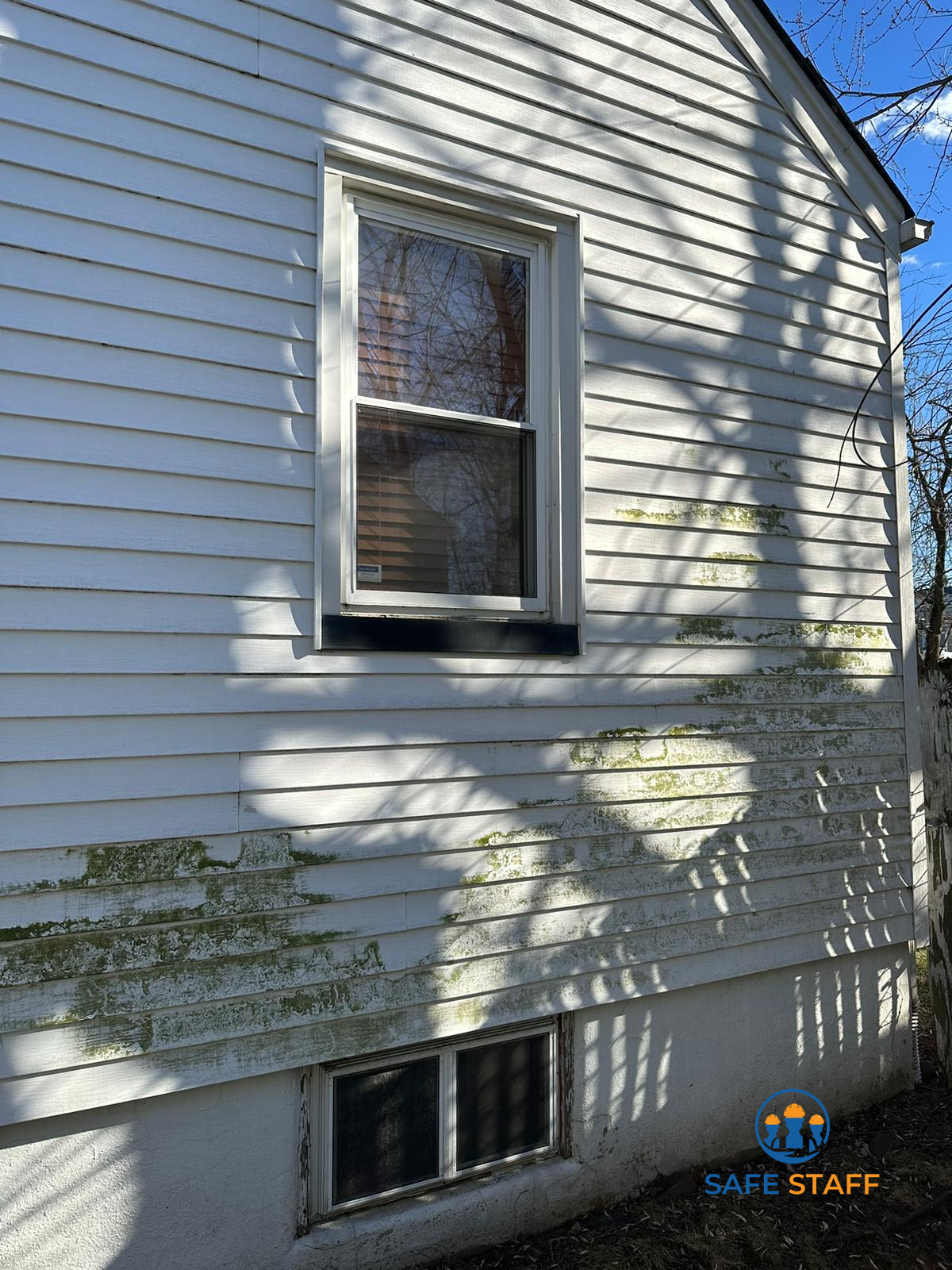 Before – siding buildup | Safe Staff Property Management